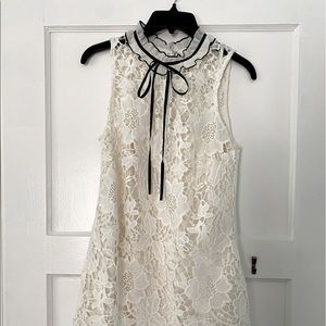 Kensie black and white lace dress with ruffle collar. Chic for office or luxury
